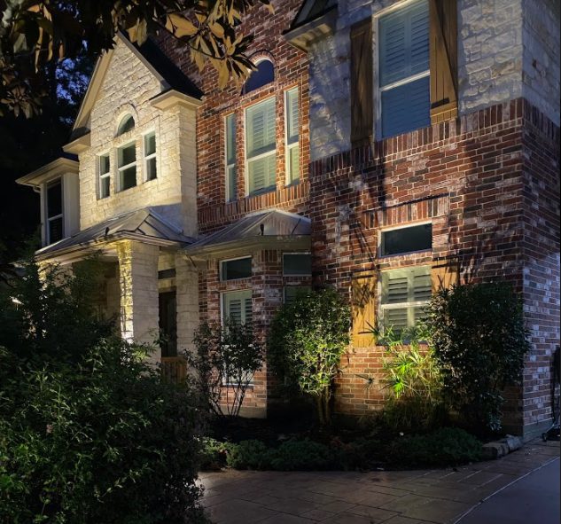 A home illuminated by outdoor lights