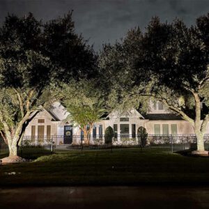 Beautiful outdoor lighting on a white home.
