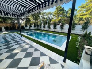 houston backyard with pool surrounded by turf