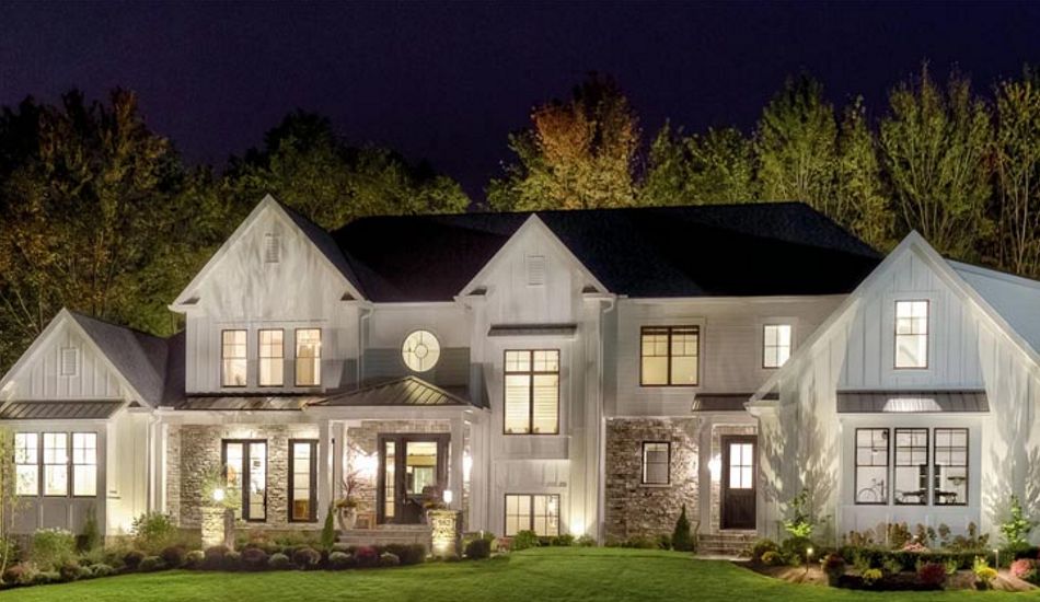 beautiful home with landscape lighting