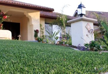 close up of synthetic turf in front of a house